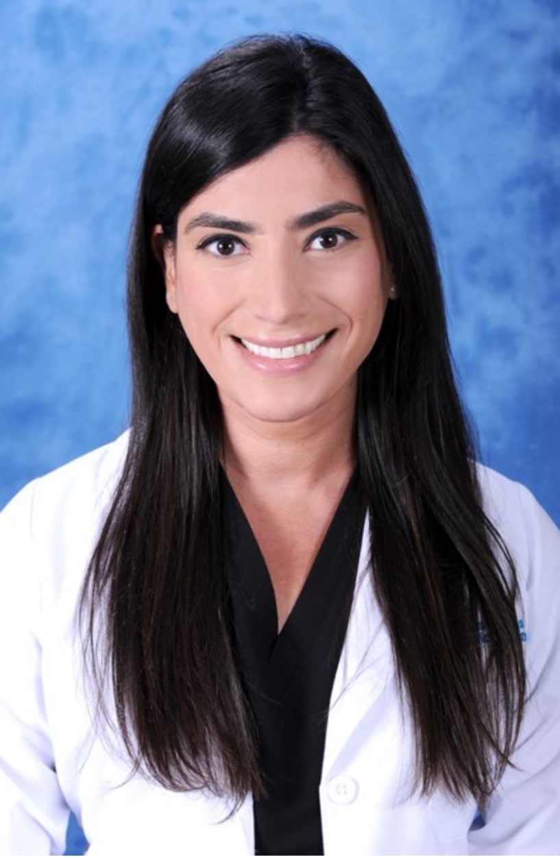 awardee wearing a headband of daisies, daisy award statue, and certificate.